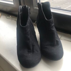 Women’s black booties.